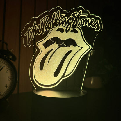 Decorative night light with a logo and text on a dark background