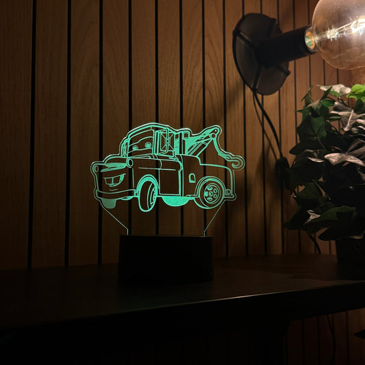 Mater tow truck LED night light glowing on a bedside table